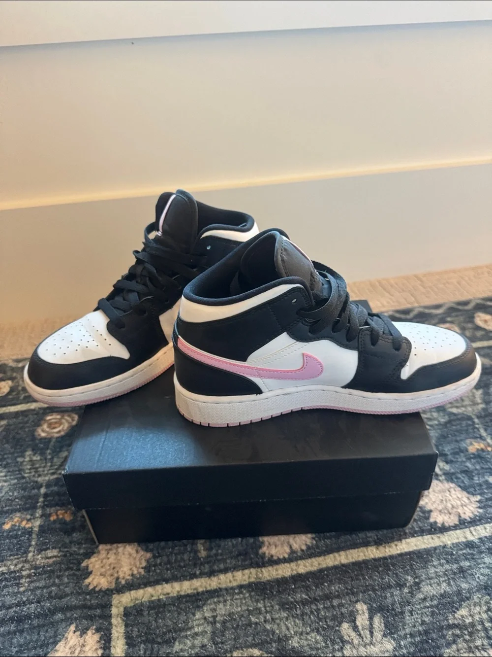 Nike Air Jordan 1 Mid High-Top Sneakers in Black, White & Pink